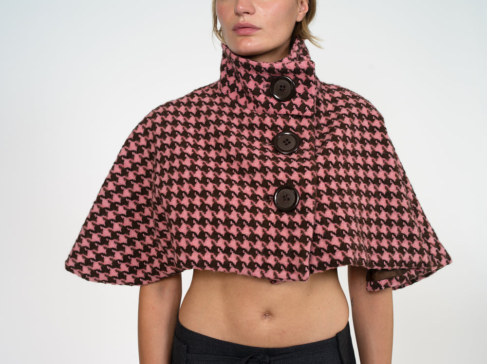 Cap buttoned to the top